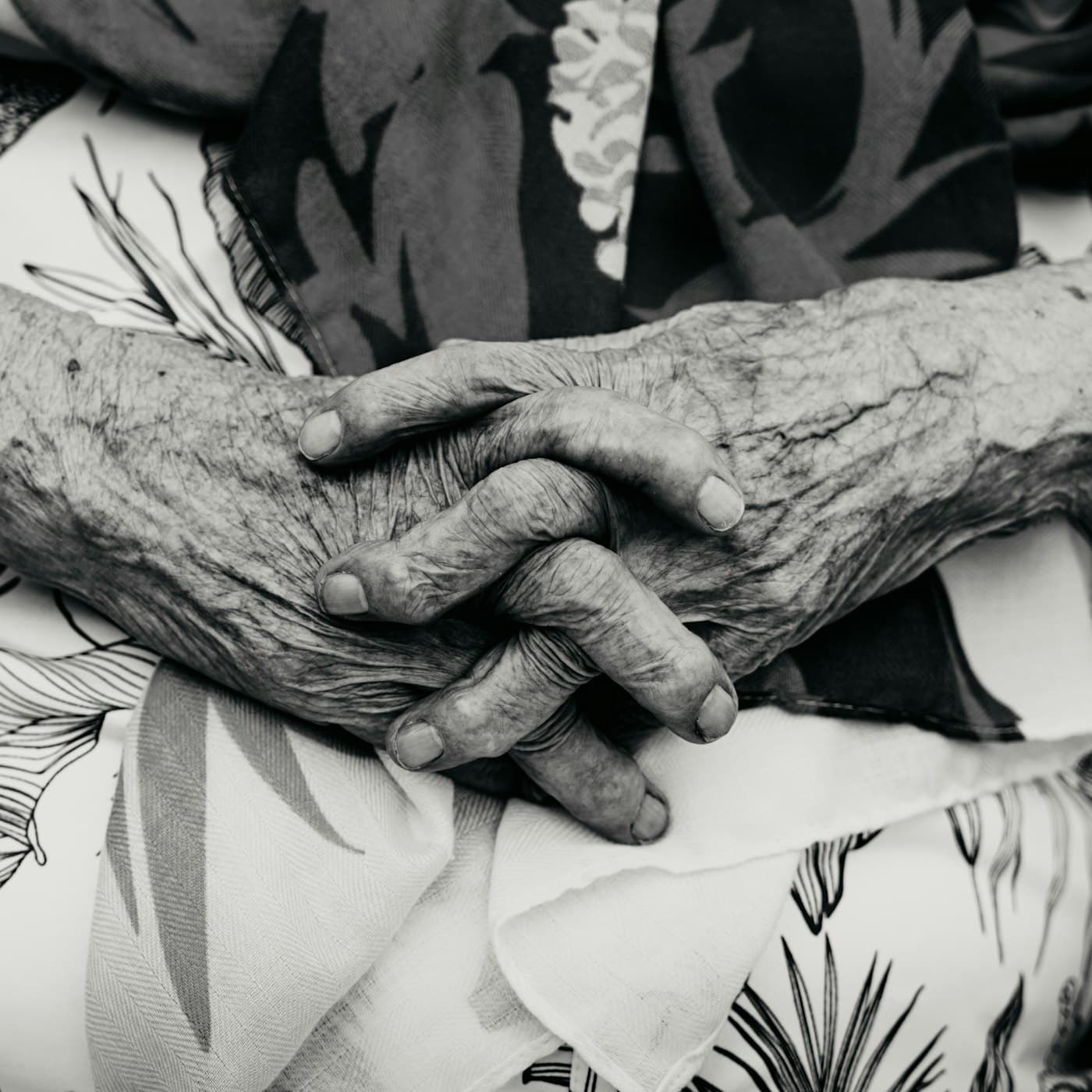 Two hands held together, resting still