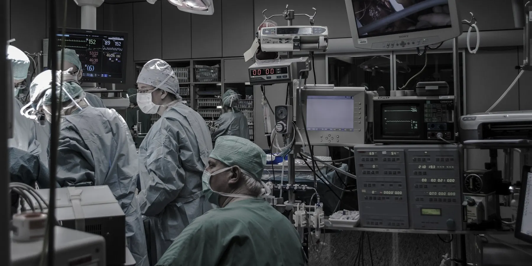 A procedure room at night, with the haemodynamic monitors lit.