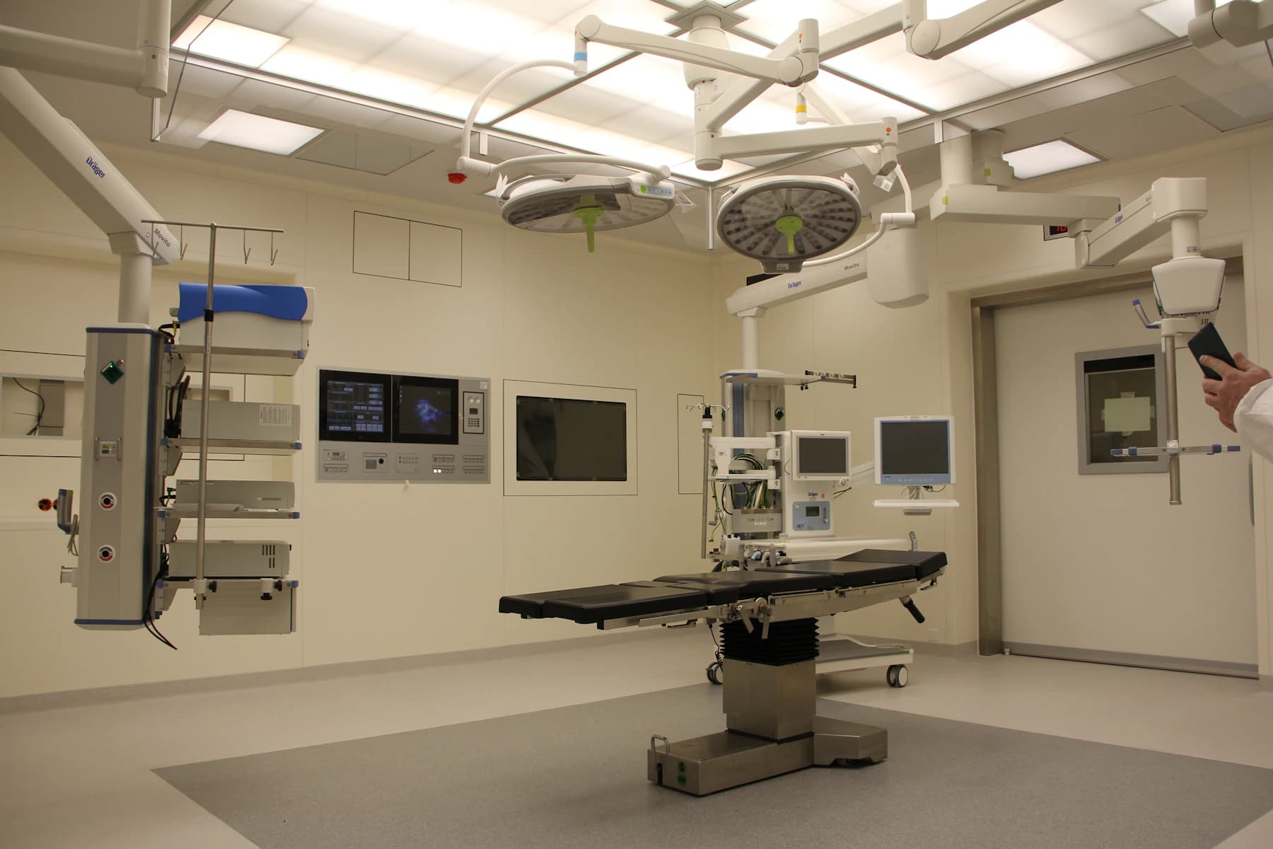 An empty operating theatre with the lights and table set for the next case.
