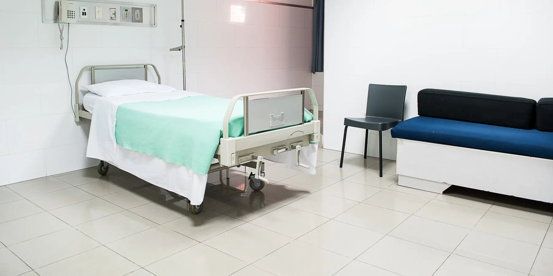 A single room on a maternity floor, prepared and empty.